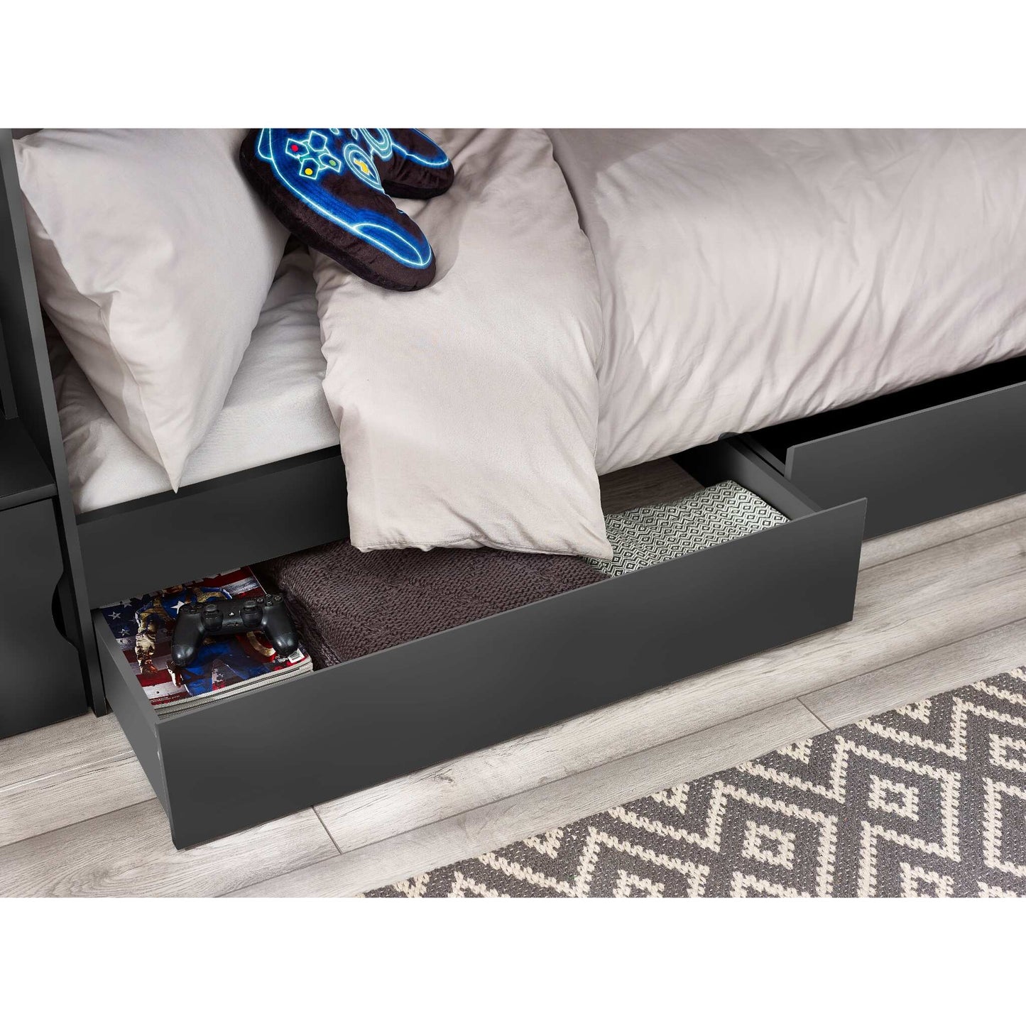 Dark grey bunk bed, close-up of open storage drawers revealing items.