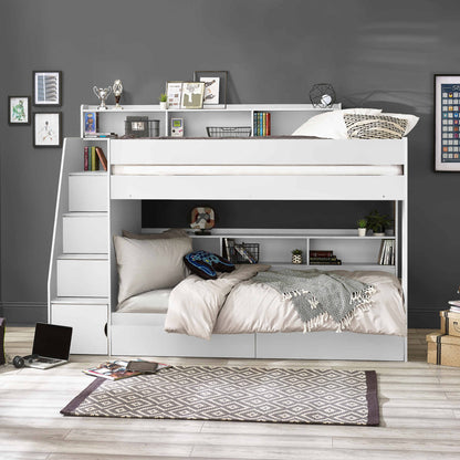 Bunk bed with side staircase in a room with a grey wall and wooden floor.