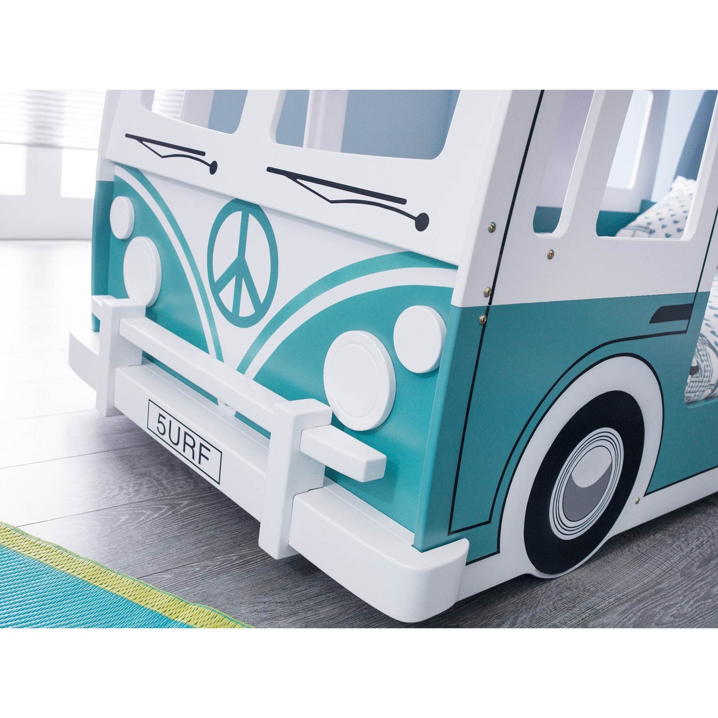 Front bumper and styling detail of Campervan Bunk Bed in green and white