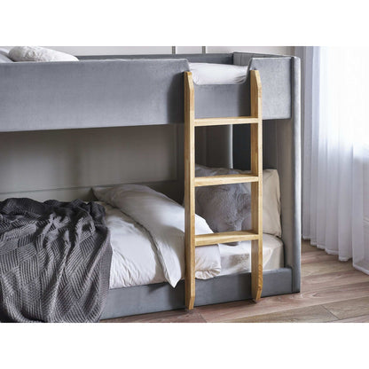 Children's bunk bed with grey velvet upholstery and a wooden ladder 