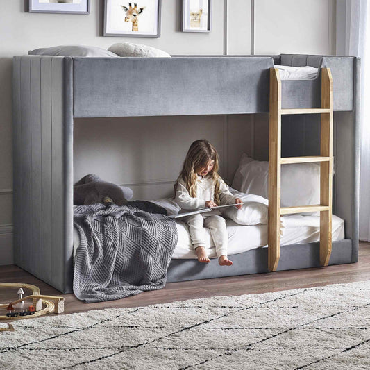 Daytona Grey Velvet Bunk Bed with a child reading on the lower bunk