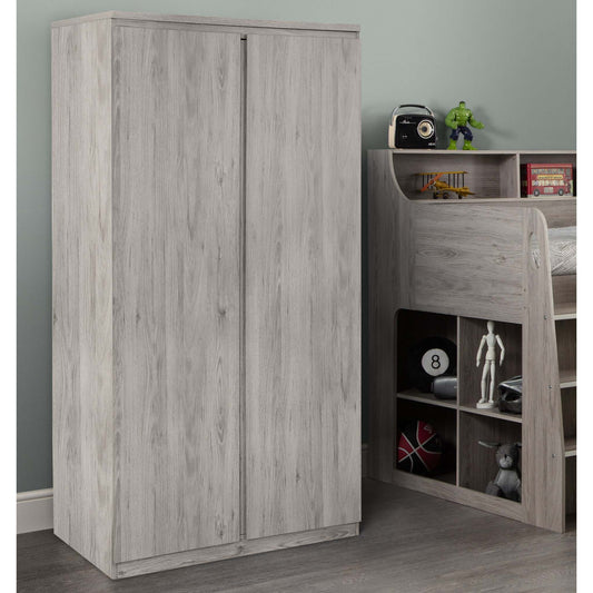 Jupiter 2-Door Wardrobe in grey oak next to the matching Jupiter Mid Sleeper Bed, in a bedroom setting
