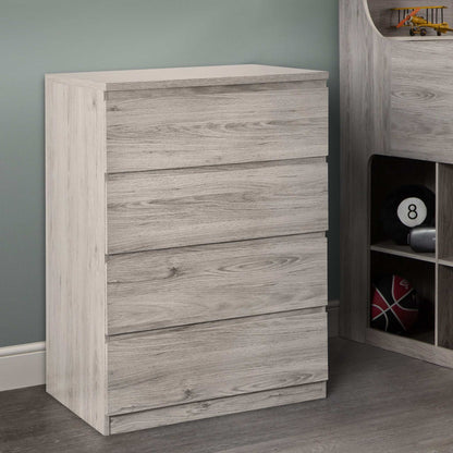 A grey oak 4-drawer chest from the Jupiter bedroom range, in a room setting