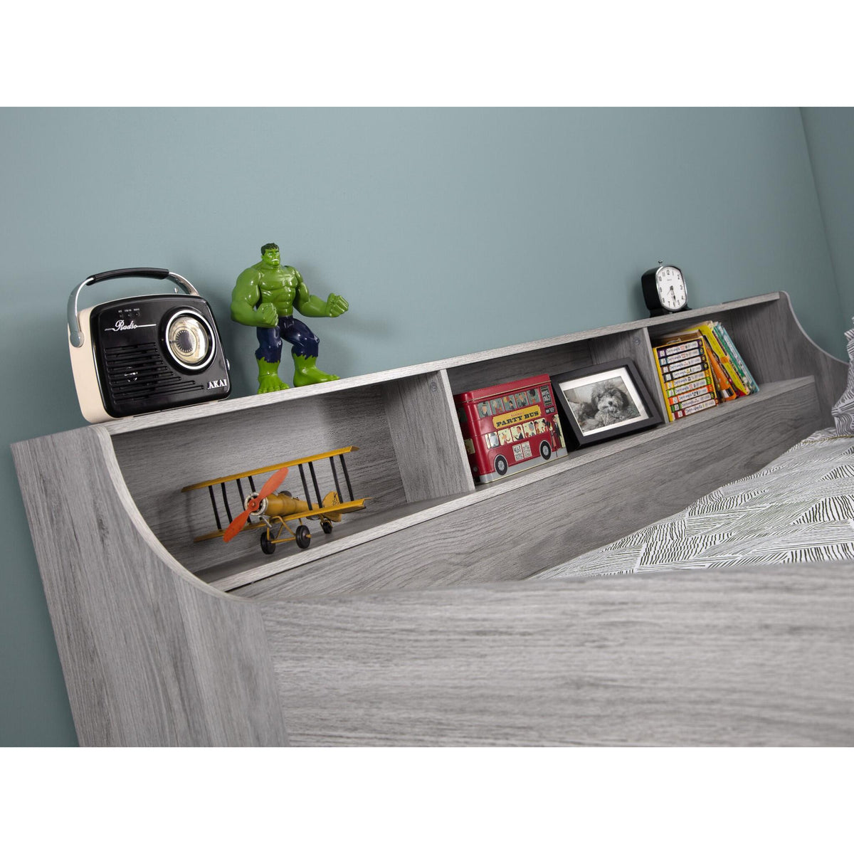 Shelf detail of this children's mid sleeper storage bed in grey oak