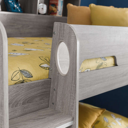 Ladder hand hole and safety rail detail of this children's bunk bed in grey oak