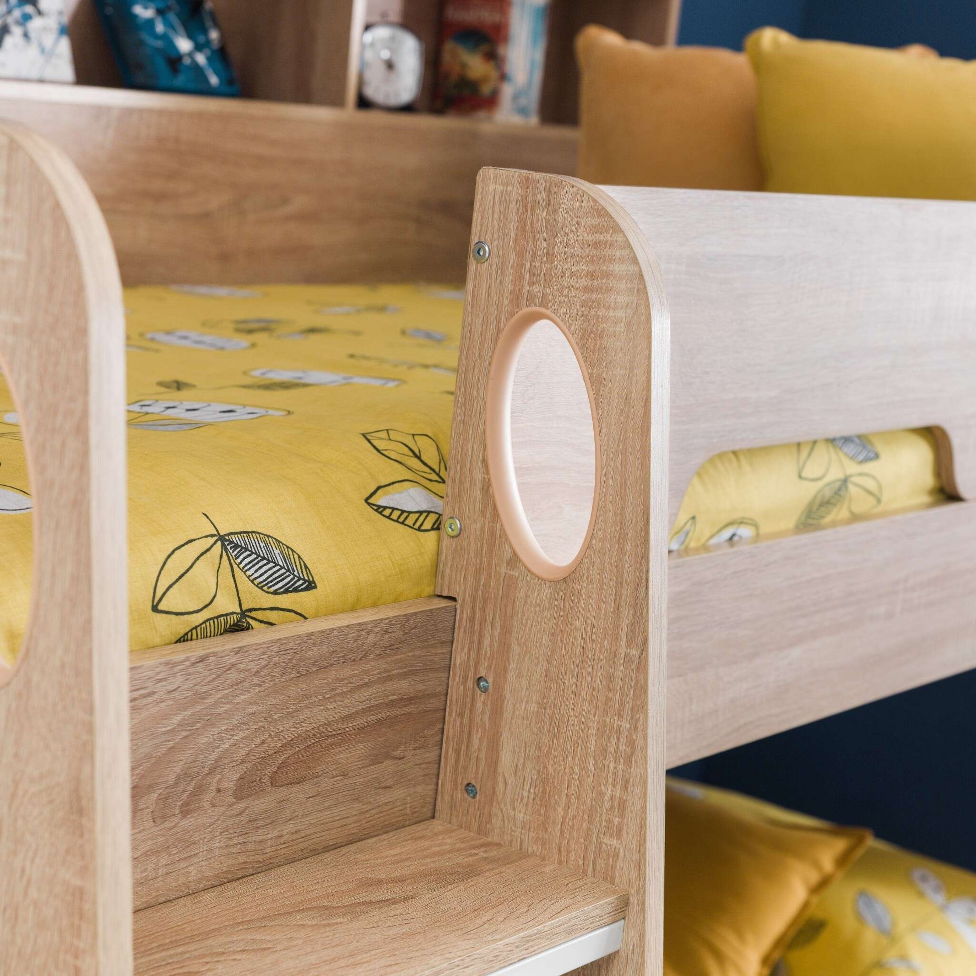 Ladder hand hole and safety rail detail of this children's bunk bed in sonoma oak