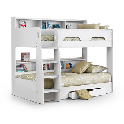 Styled angled view of this white bunk bed with mattresses and open storage drawer
