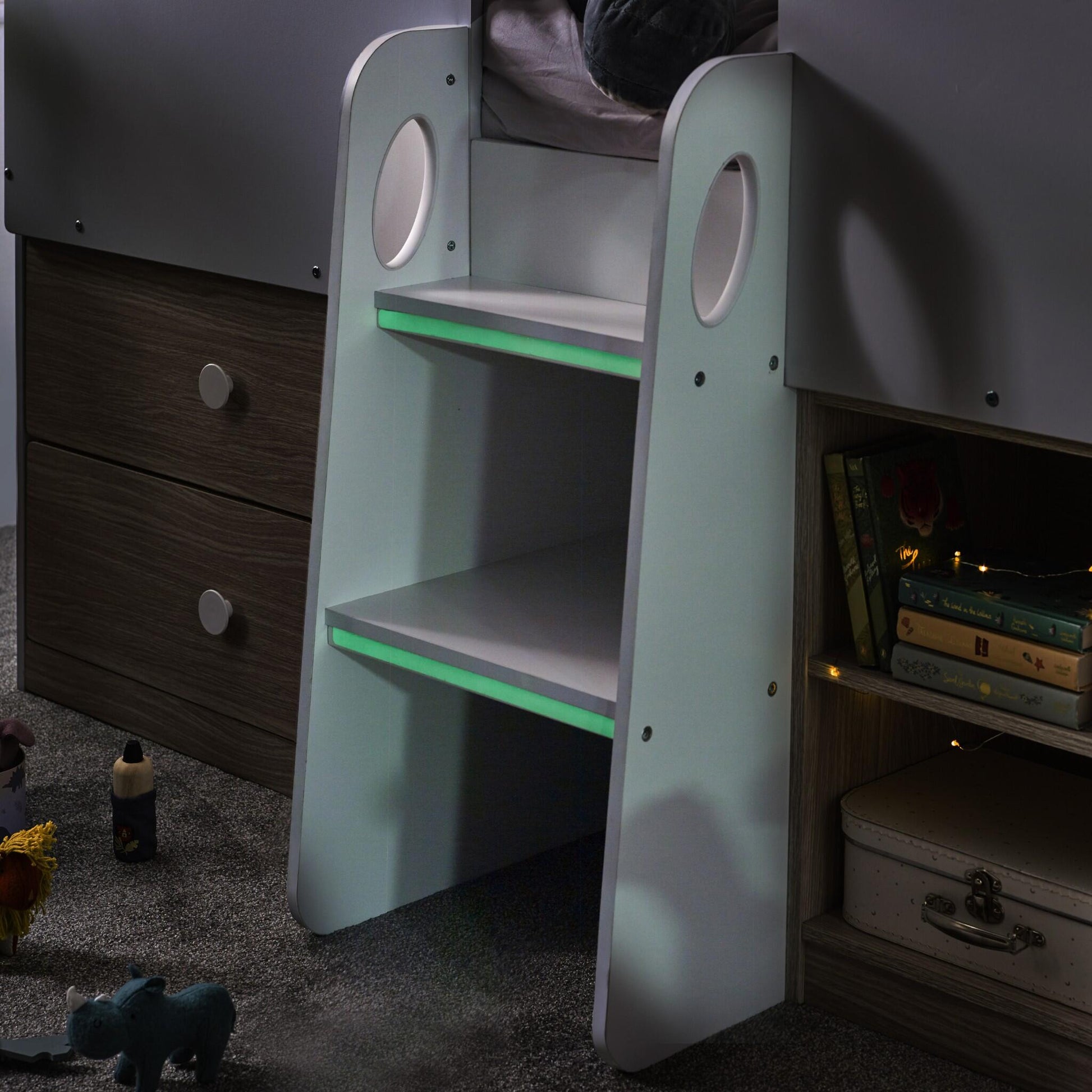 Luminous ladder steps of the Orpheus Mid Sleeper House Bed with pale wood styling