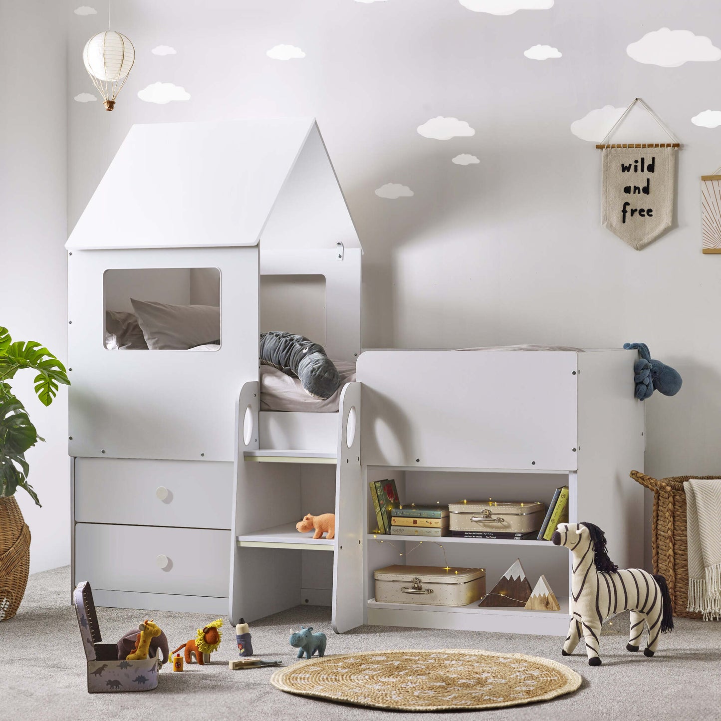 Orpheus Mid Sleeper House Bed in white shown in a child's bedroom setting