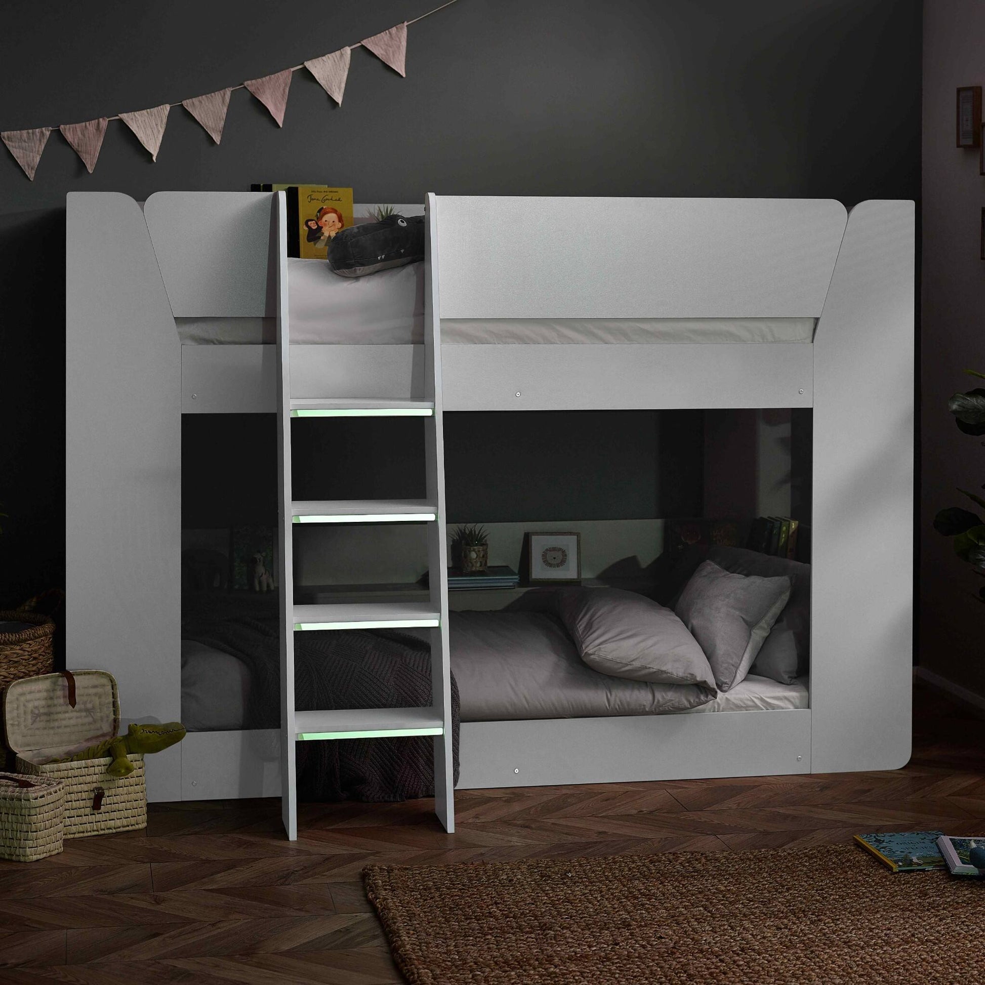 Parsec Bunk Bed in white shown in low lighting with luminous steps on show