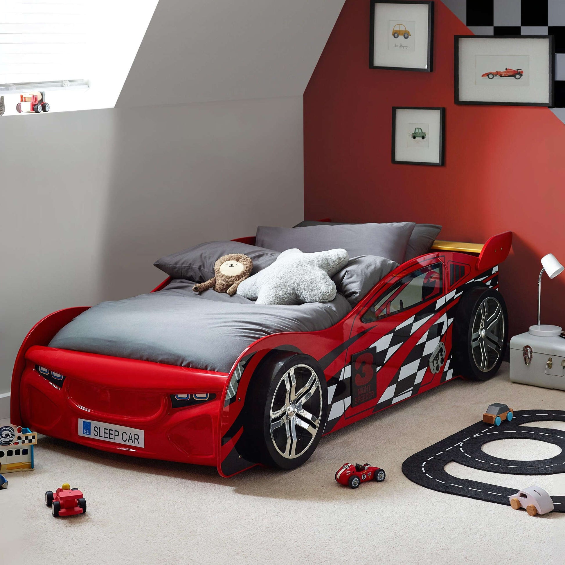 Scorpion Race Car Bed in gloss red in a child's bedroom setting with toys and decor