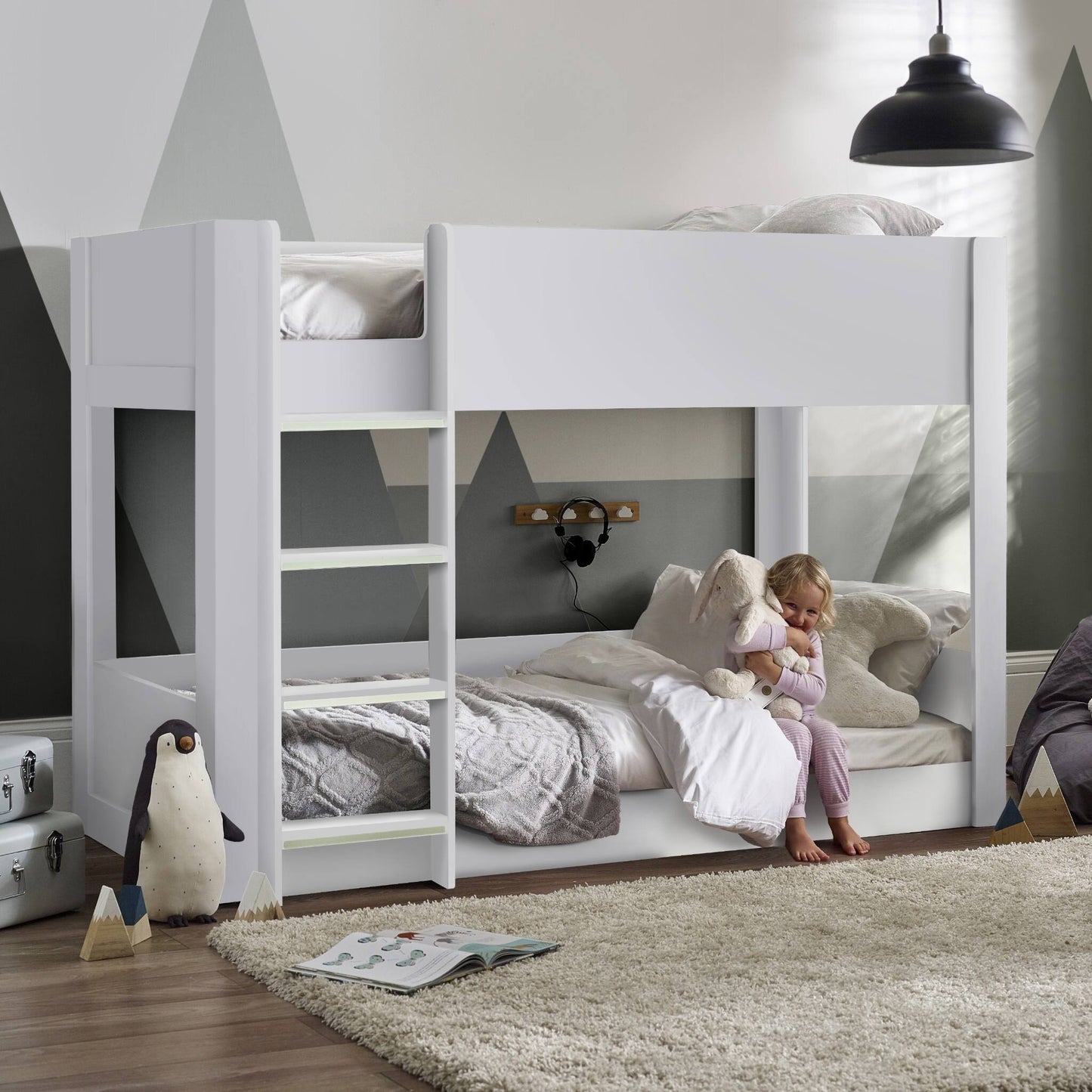 Solomon Bunk Bed with a white finish and low-level design shown in a child’s bedroom setting