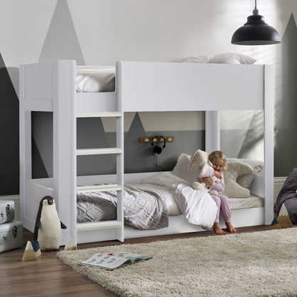 Solomon Bunk Bed with a white finish and low-level design shown in a child’s bedroom setting